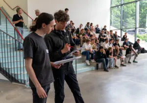 Referees are discussing the performance of a vehicle